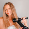 Model using Board Bristle Ceramic Brush in hair with the Blowout Dryer