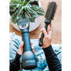 Lifestyle image of the Boar Bristle Ceramic Brush and Blowout Handle-less Dryer.