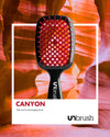 UNbrush Detangling Hair Brush in Canyon Red with a polaroid background