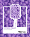 UNbrush Plus Detangling Hair Brush  in Sugar Plum Purple with polaroid background