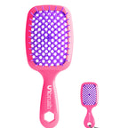 Pink hairbrush with purple bristles on a white background