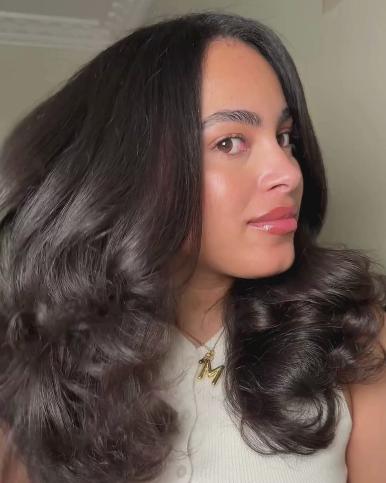 Image of the FHI Heat Versasphere 6-in-1 Multi-Styler with a model using multiple attachments to achieve a blowout hair style