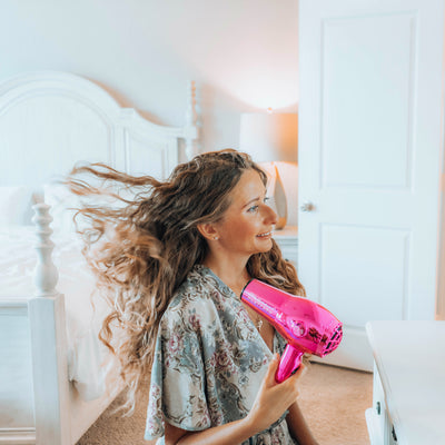 Pink Chrome Limited Edition Hair Tool In Use By Curly Haired Model